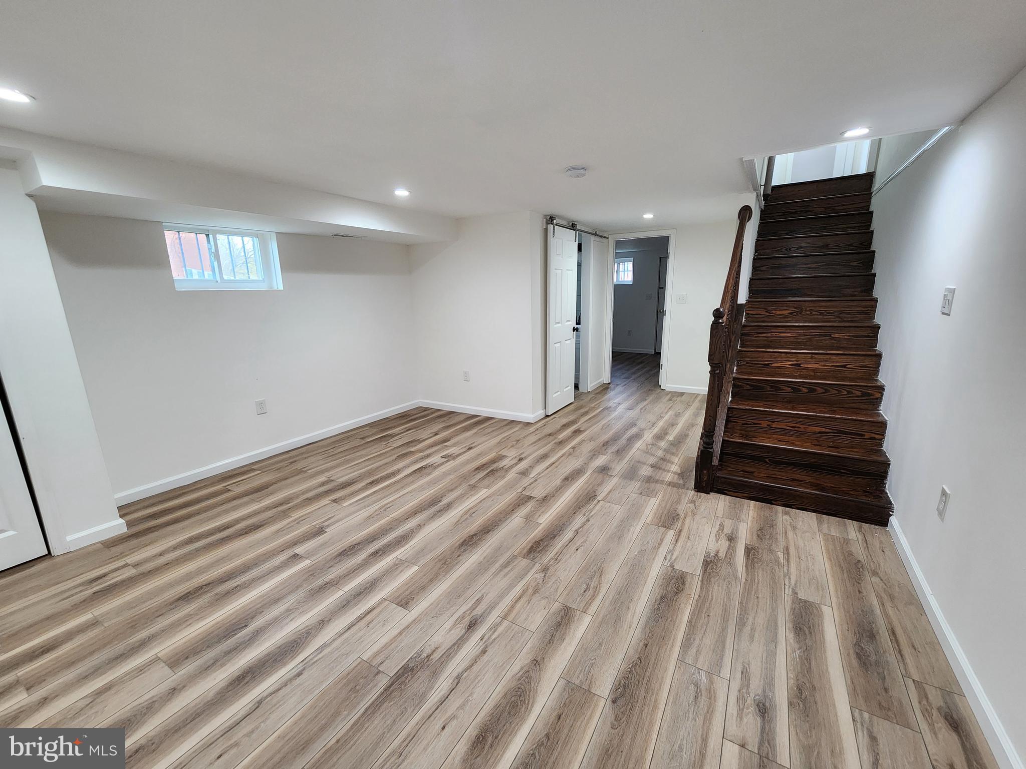 1261 Gallatin Street Northeast Washington, DC 20017 - Photo 36 of 60 a view of a room with wooden floor and stairs