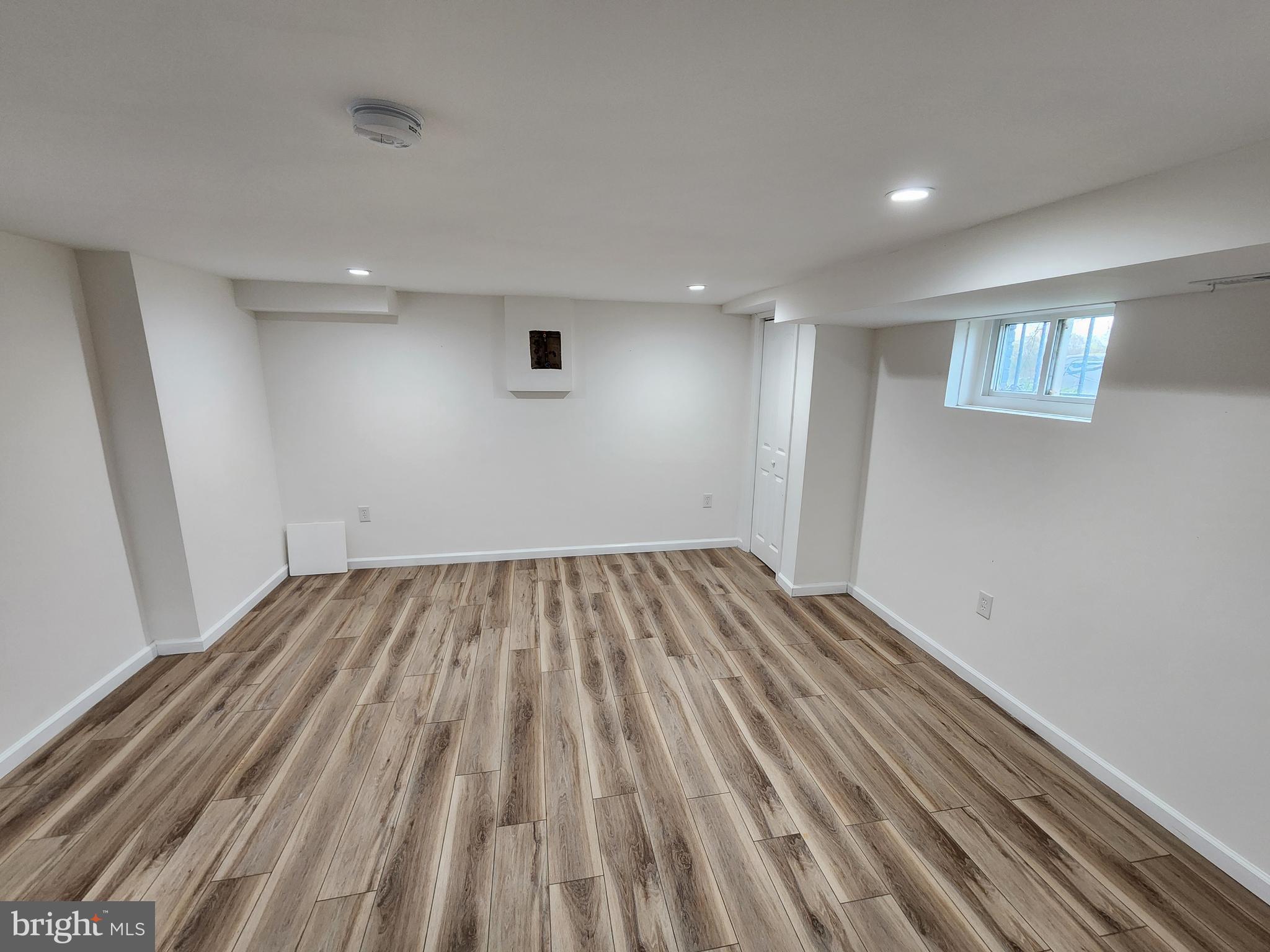 1261 Gallatin Street Northeast Washington, DC 20017 - Photo 38 of 60 a view of empty room with wooden floor