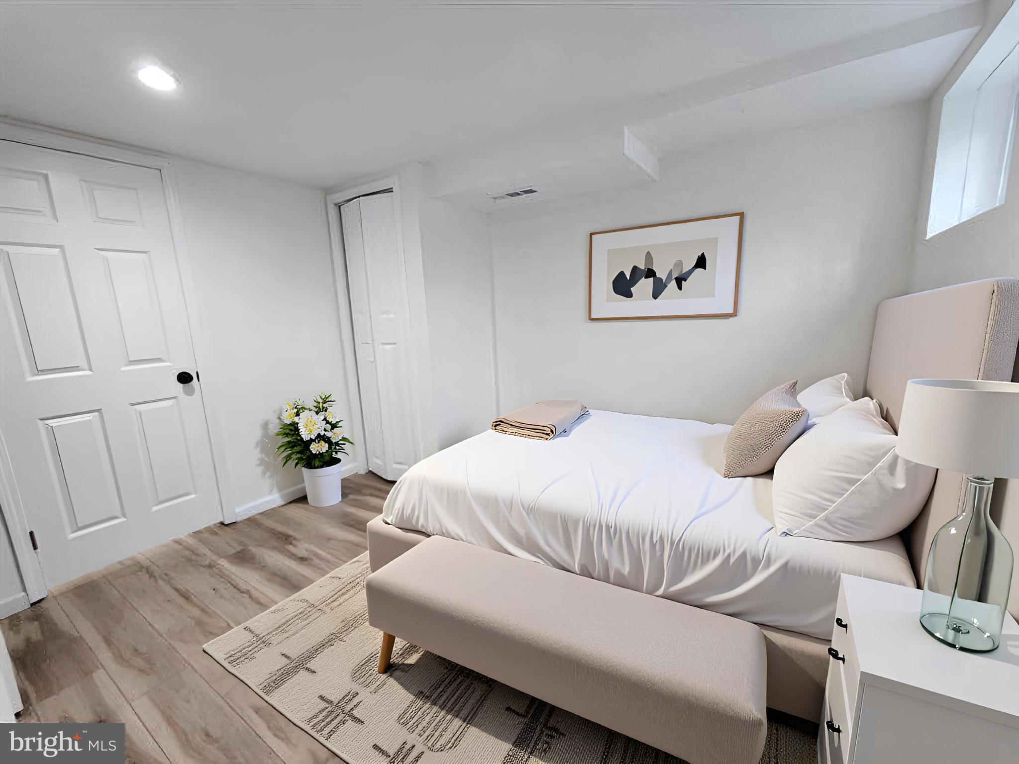 1261 Gallatin Street Northeast Washington, DC 20017 - Photo 44 of 60 a bedroom with a bed and a couch