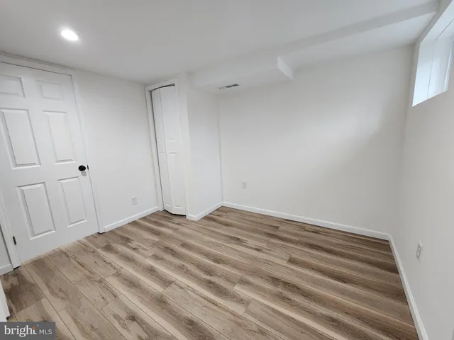 a view of a brick house with large windows