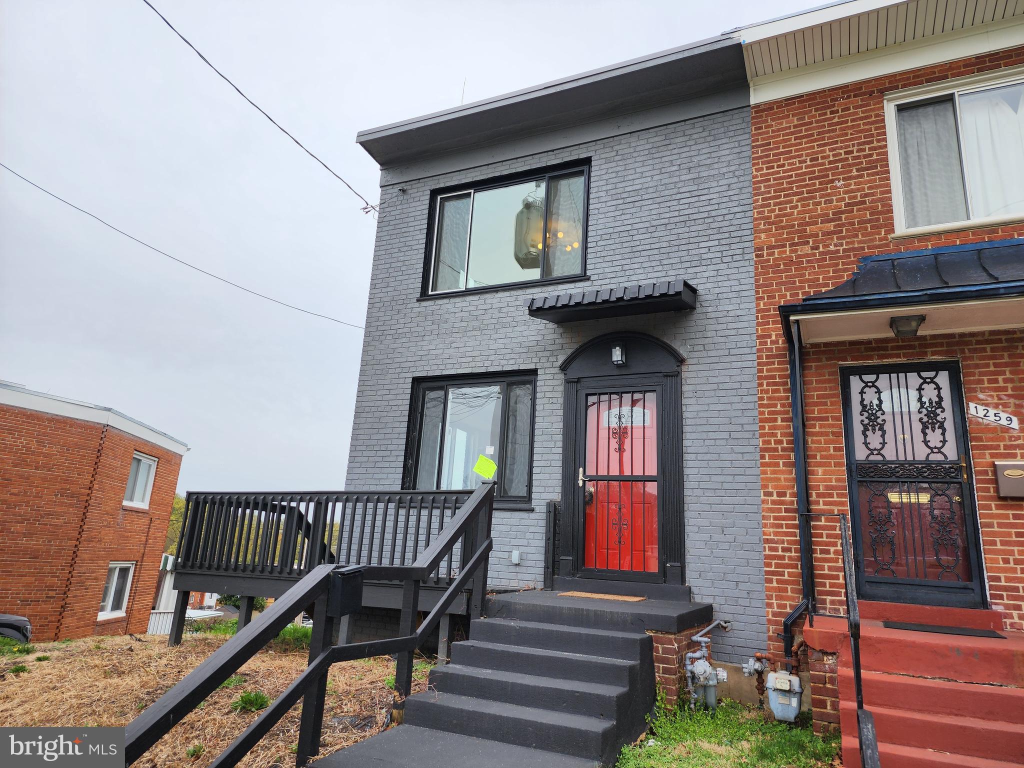 1261 Gallatin Street Northeast Washington, DC 20017 - Photo 47 of 60 a front view of a house with a porch