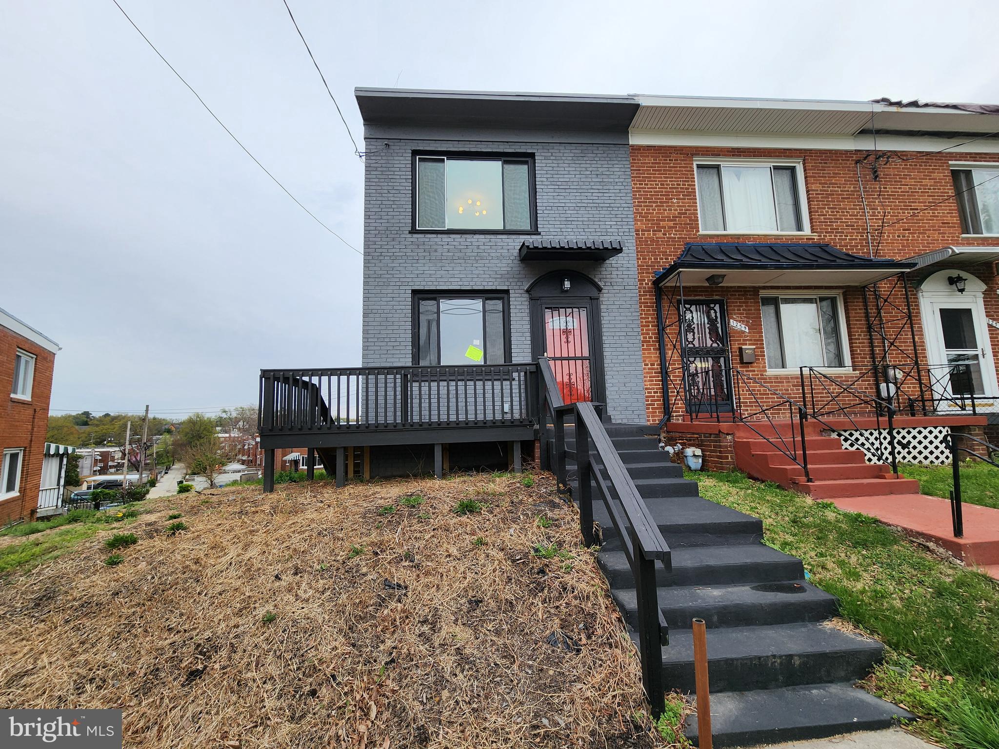1261 Gallatin Street Northeast Washington, DC 20017 - Photo 50 of 60 a view of front of house with a yard
