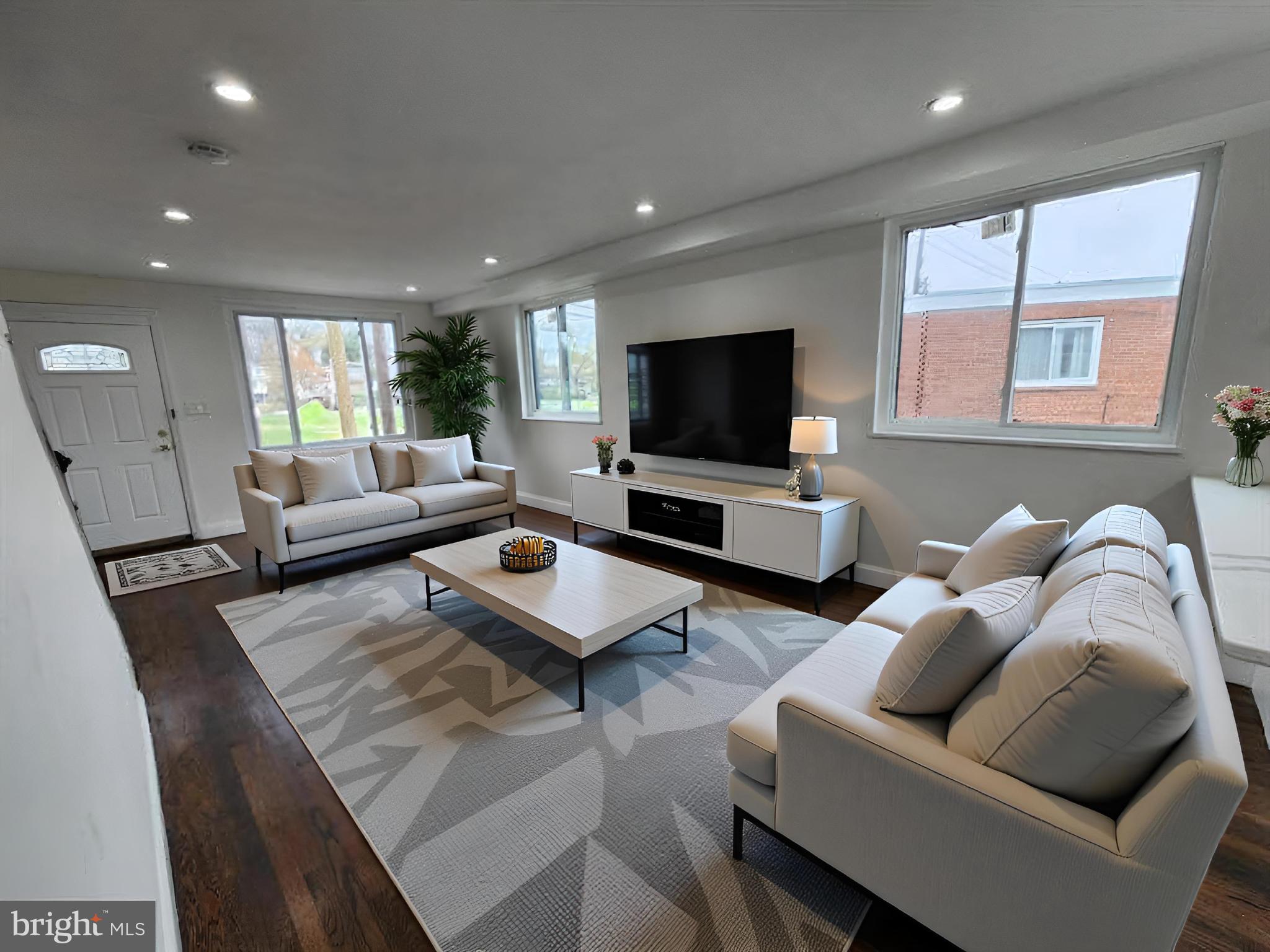 1261 Gallatin Street Northeast Washington, DC 20017 - Photo 5 of 60 a living room with furniture and a flat screen tv