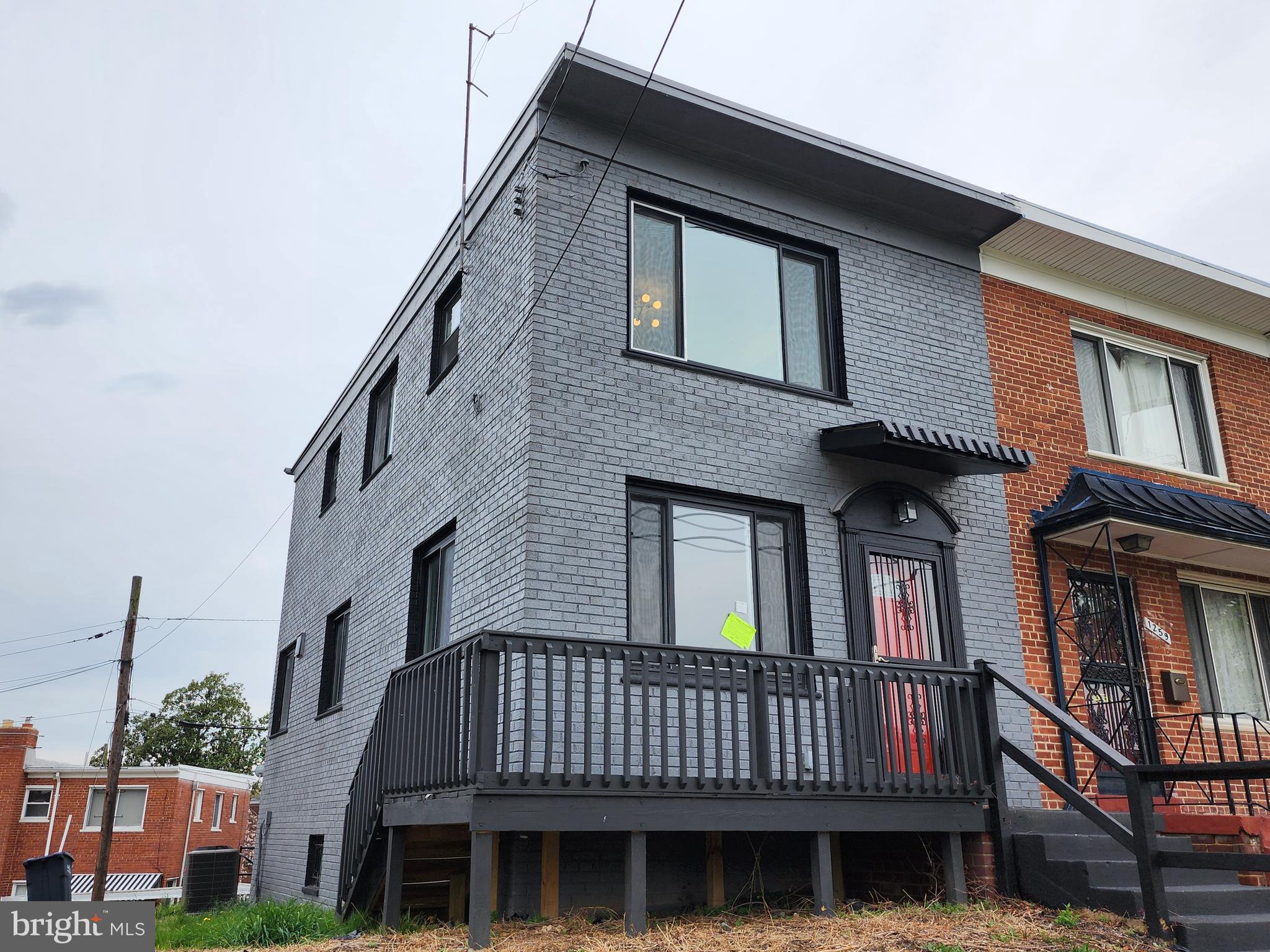 1261 Gallatin Street Northeast Washington, DC 20017 - Photo 52 of 60 a front view of a house with iron fence