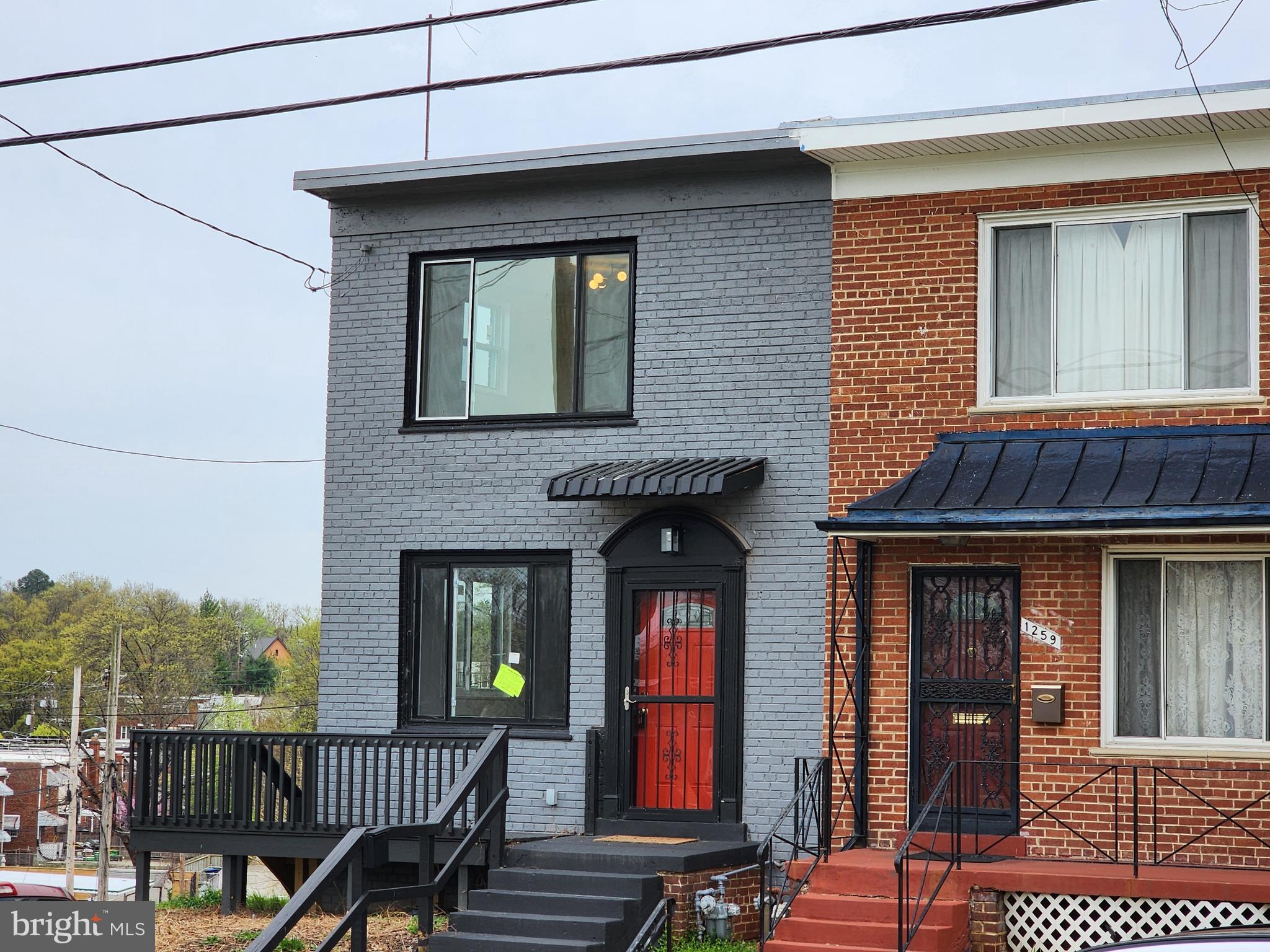1261 Gallatin Street Northeast Washington, DC 20017 - Photo 54 of 60 a view of a brick house with large windows