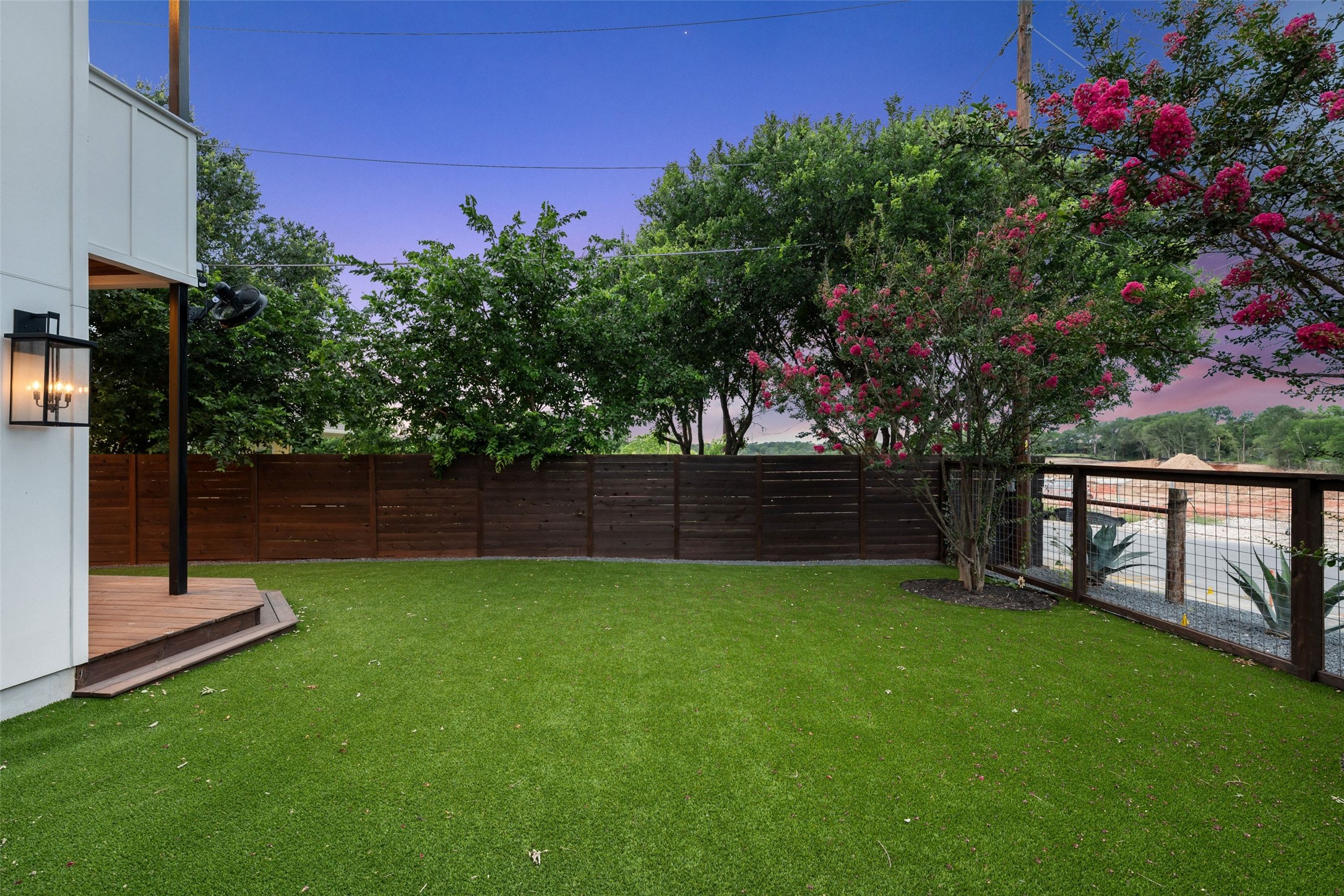 5601 Jackie Robinson Street, Unit 1 Austin, TX 78721 - Photo 34 of 40 Mature landscaping surrounds the property, while an original hitching post offers a rare nod to East Austin’s historic roots.