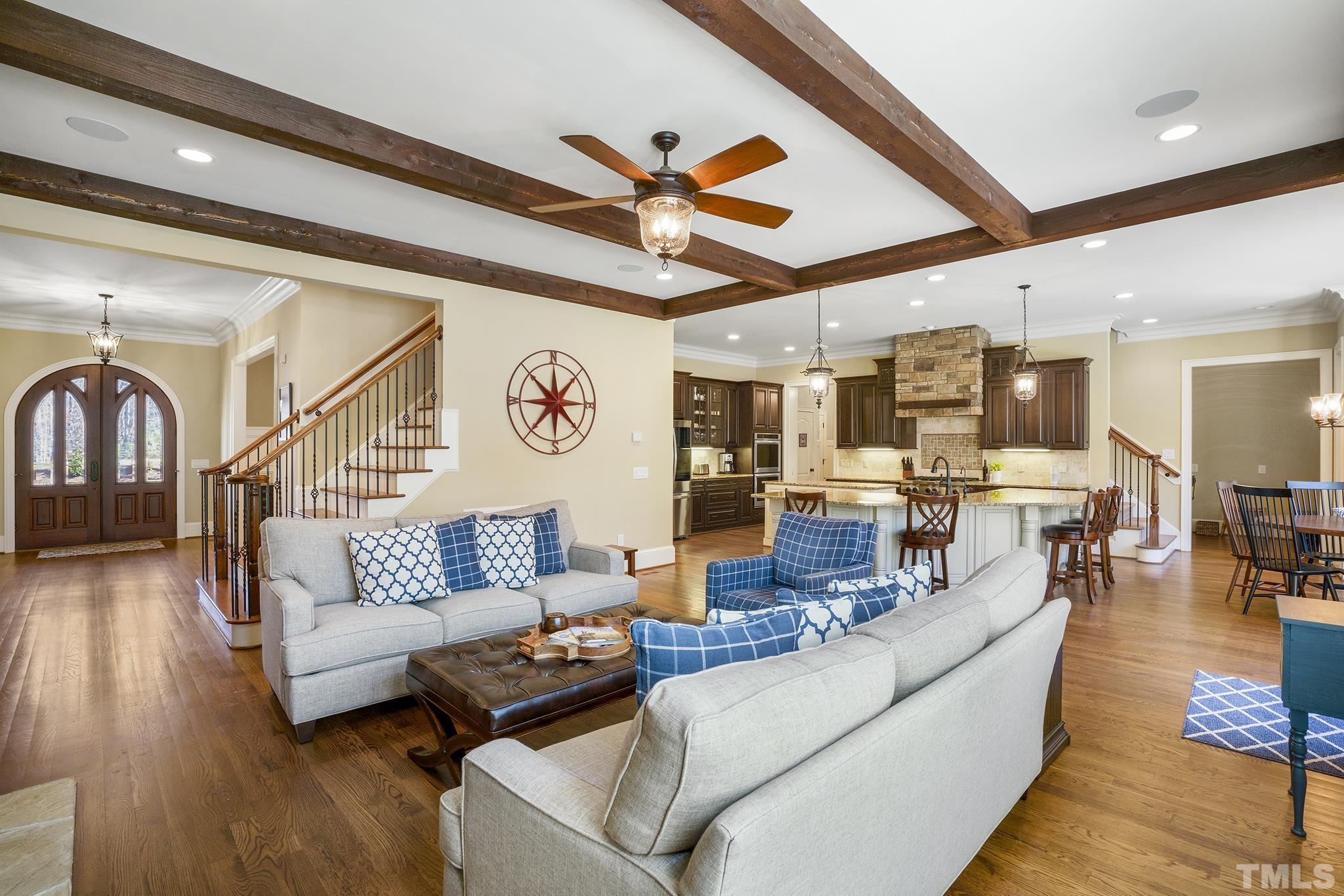 6837 Mactavish Way Raleigh, NC 27613 - Photo 11 of 48 a living room with furniture kitchen view and a wooden floor