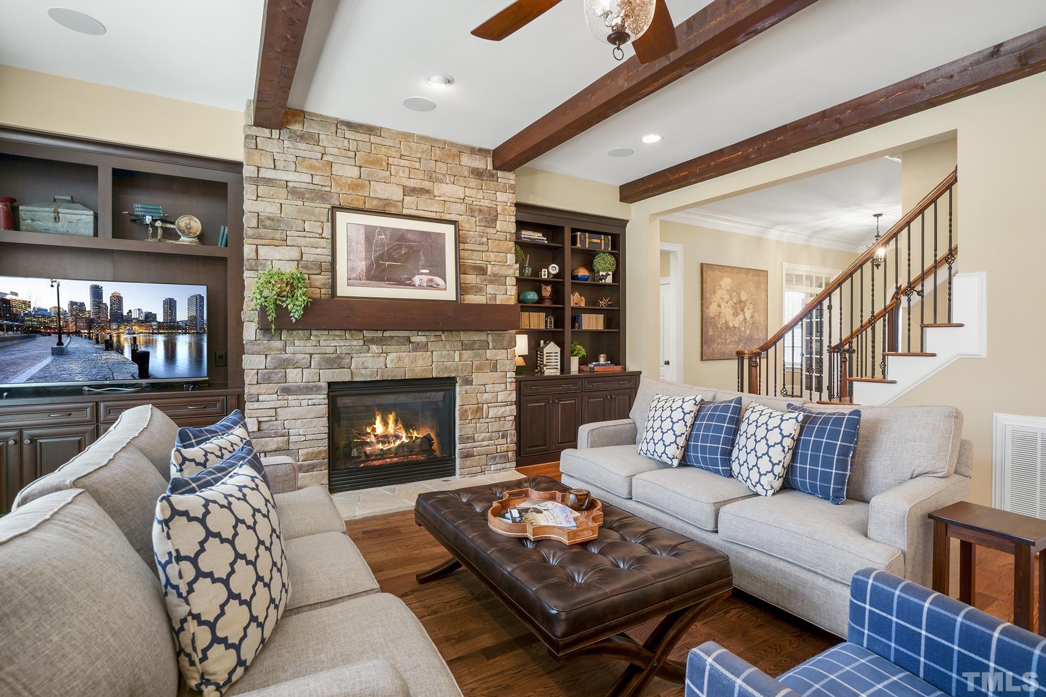 6837 Mactavish Way Raleigh, NC 27613 - Photo 13 of 48 a living room with furniture and a fireplace