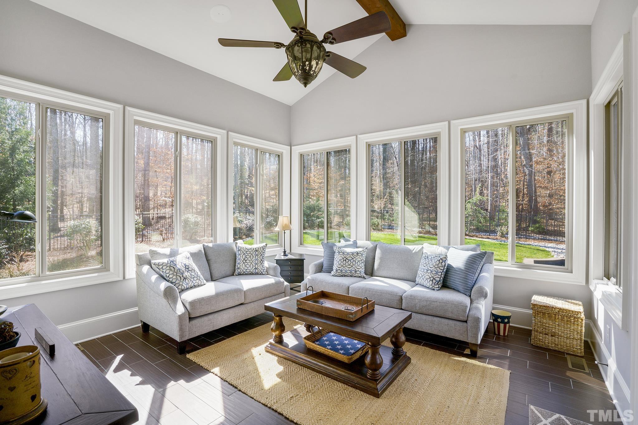 6837 Mactavish Way Raleigh, NC 27613 - Photo 19 of 48 a living room with furniture and a large window with balcony view