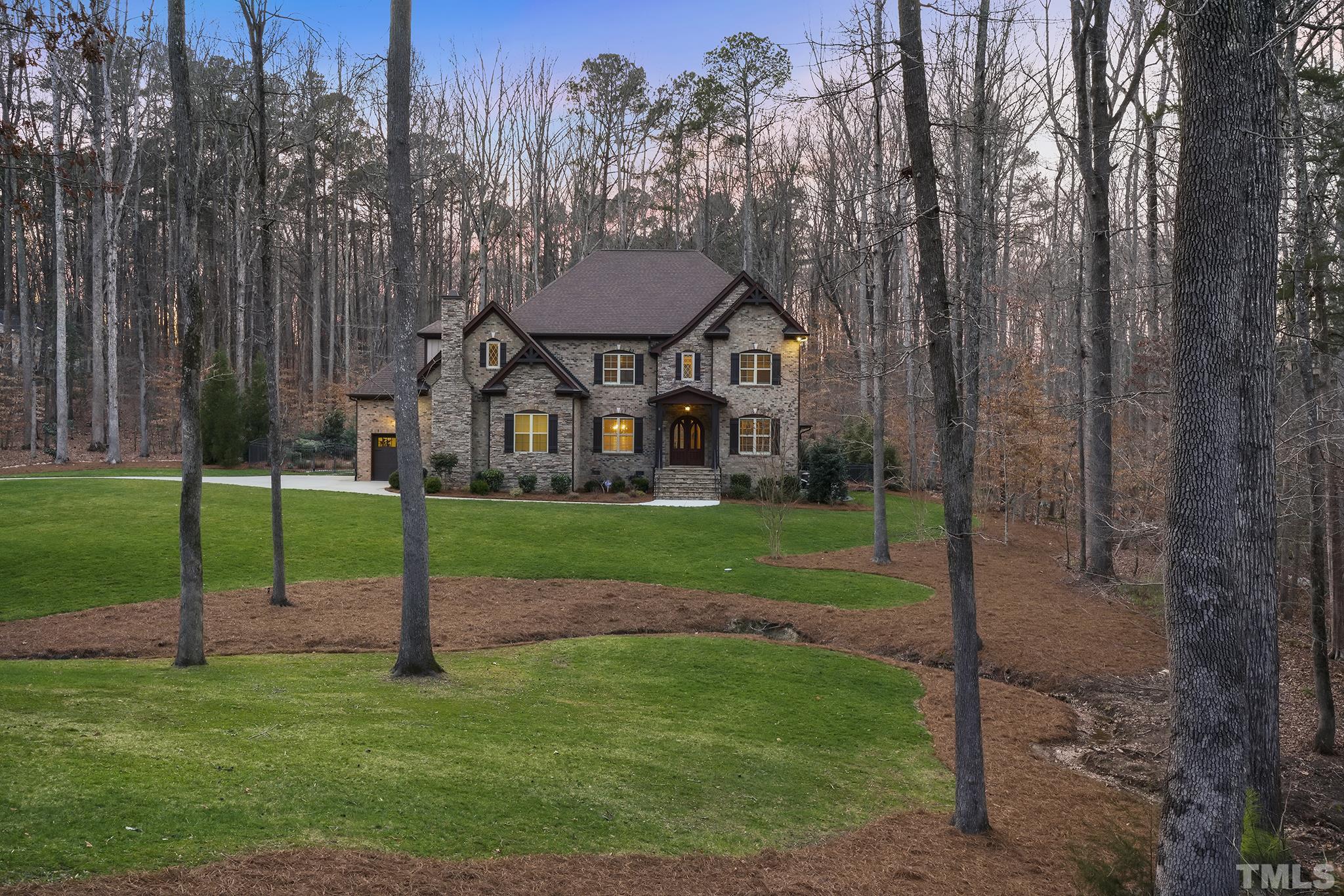 6837 Mactavish Way Raleigh, NC 27613 - Photo 2 of 48 a view of a house with a backyard