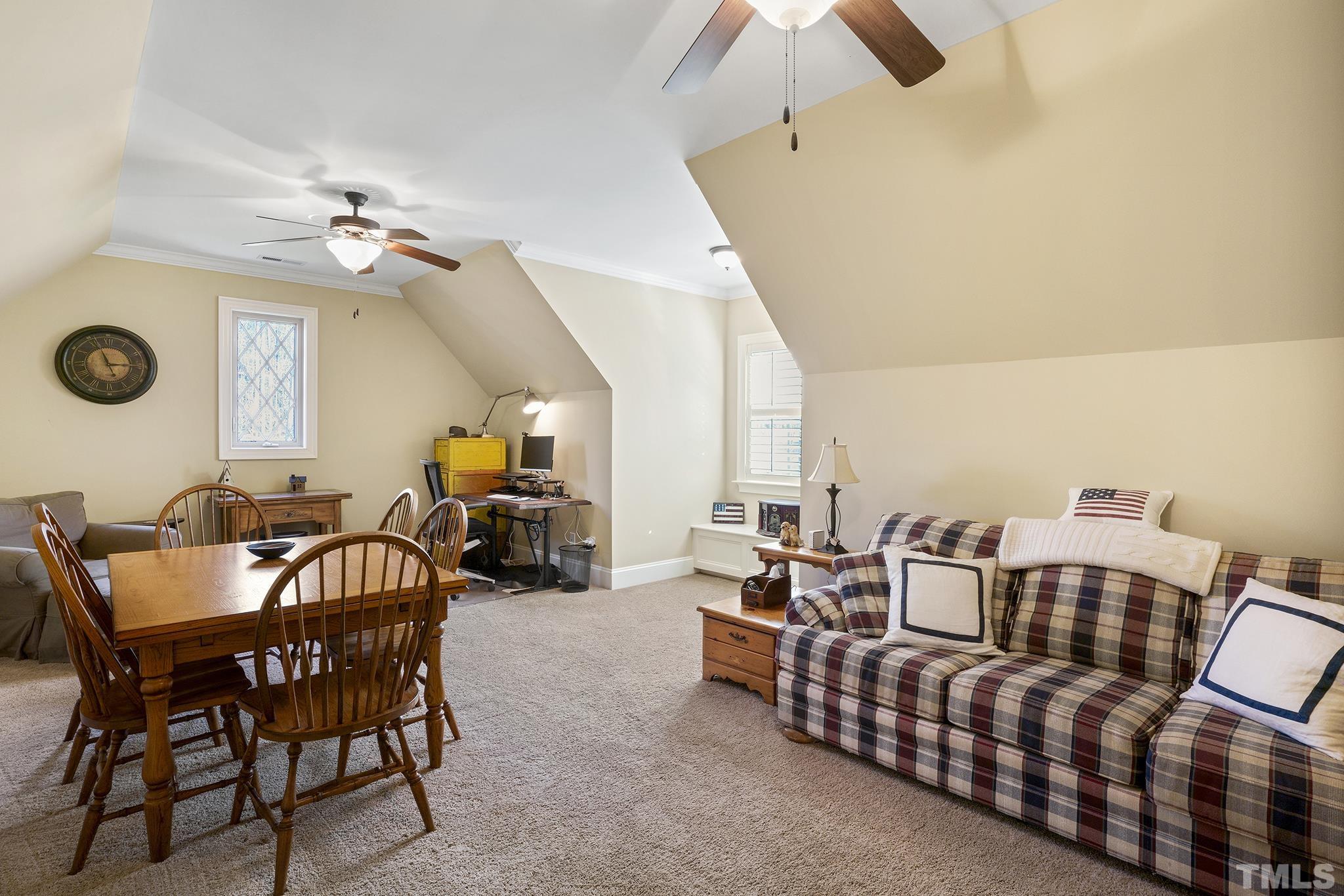 6837 Mactavish Way Raleigh, NC 27613 - Photo 34 of 48 a living room with furniture and a fireplace