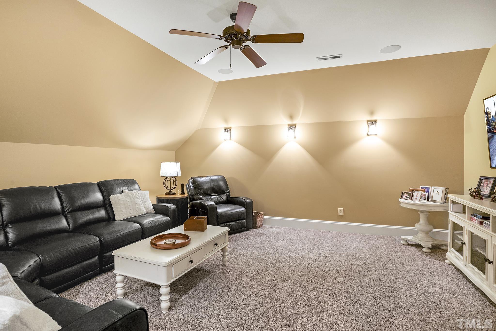 6837 Mactavish Way Raleigh, NC 27613 - Photo 37 of 48 a living room with furniture and a ceiling fan