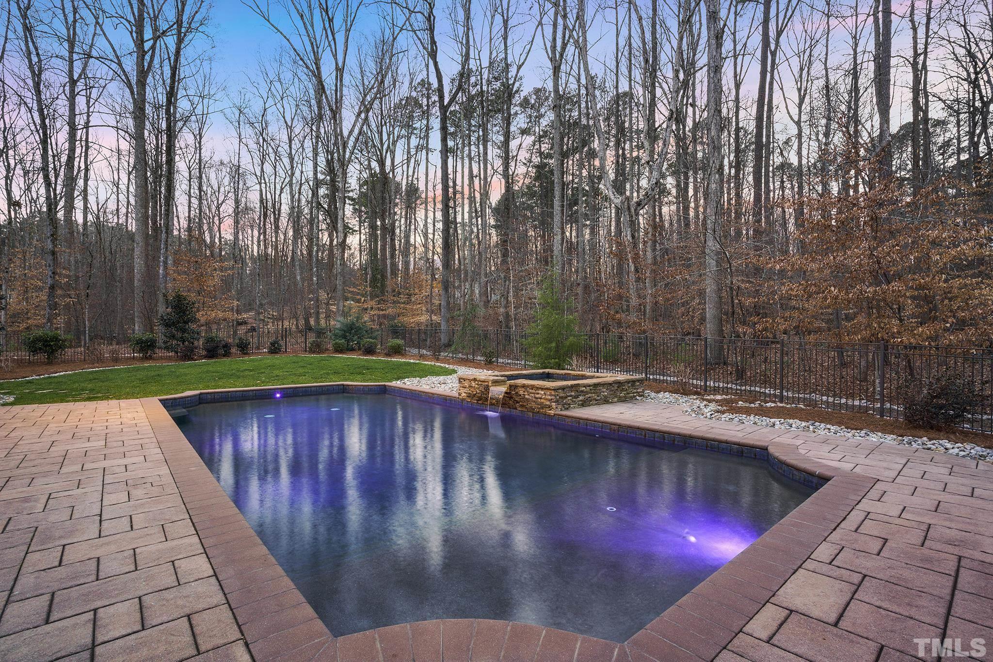 6837 Mactavish Way Raleigh, NC 27613 - Photo 40 of 48 a swimming pool with wooden fence