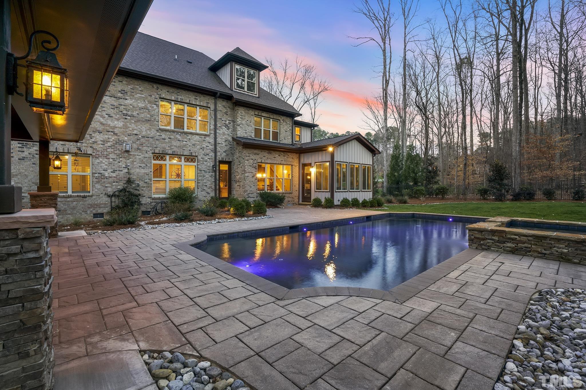 6837 Mactavish Way Raleigh, NC 27613 - Photo 4 of 48 a front view of house with yard and outdoor seating