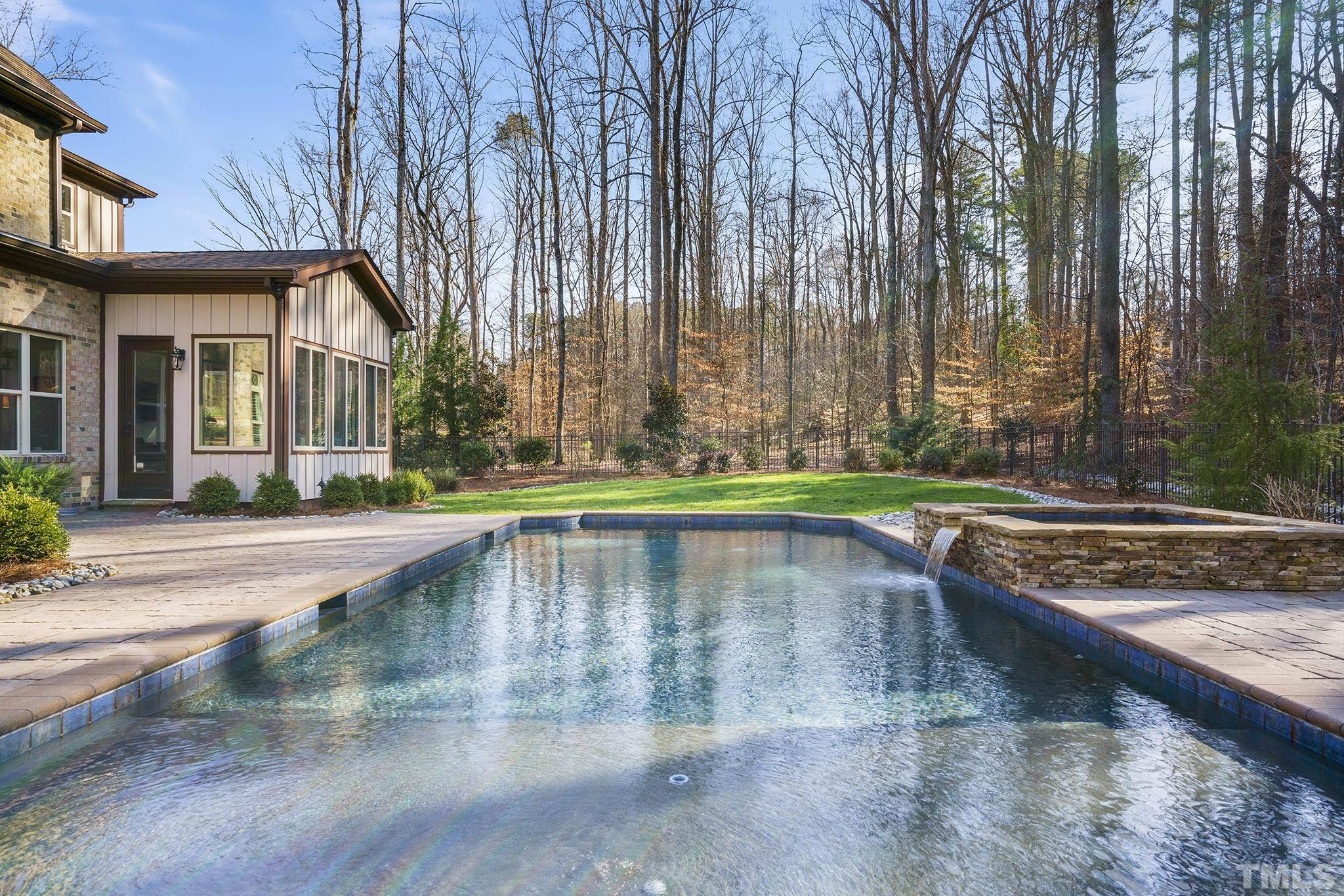 6837 Mactavish Way Raleigh, NC 27613 - Photo 43 of 48 a swimming pool with outdoor seating and yard