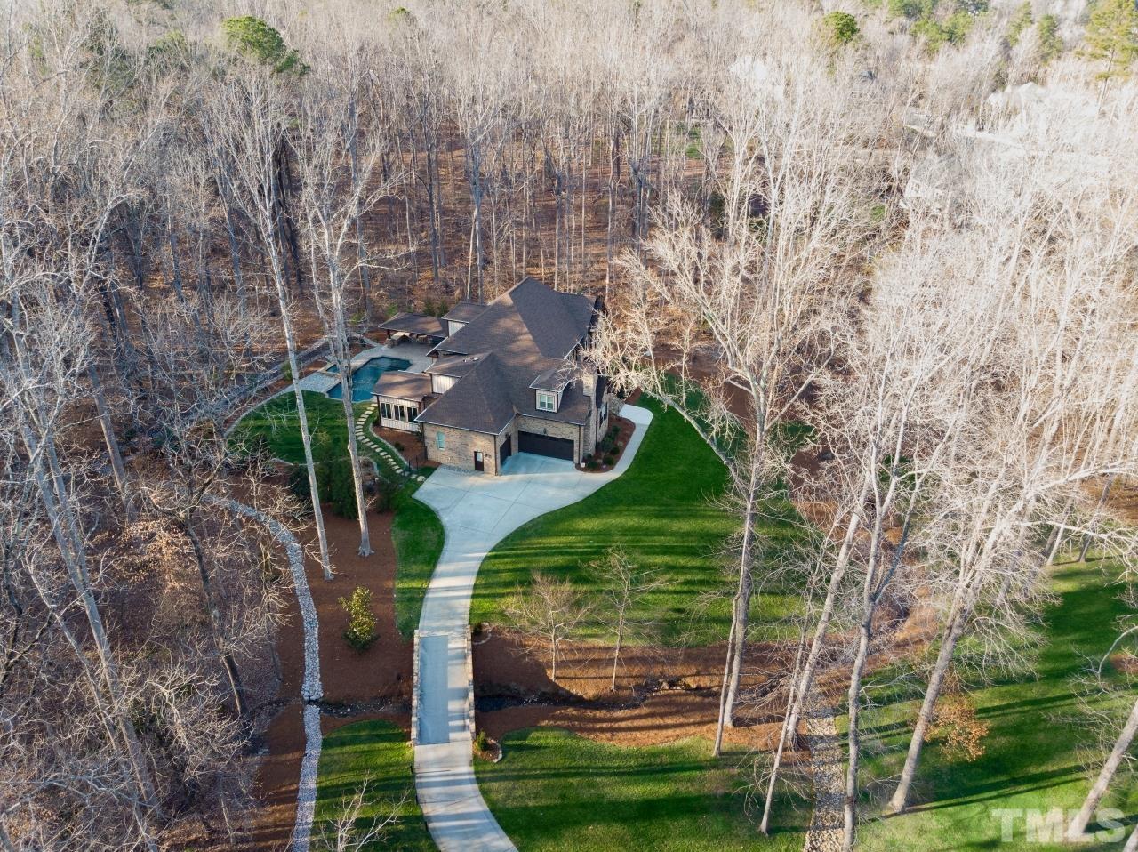6837 Mactavish Way Raleigh, NC 27613 - Photo 6 of 48 a green field with lots of trees
