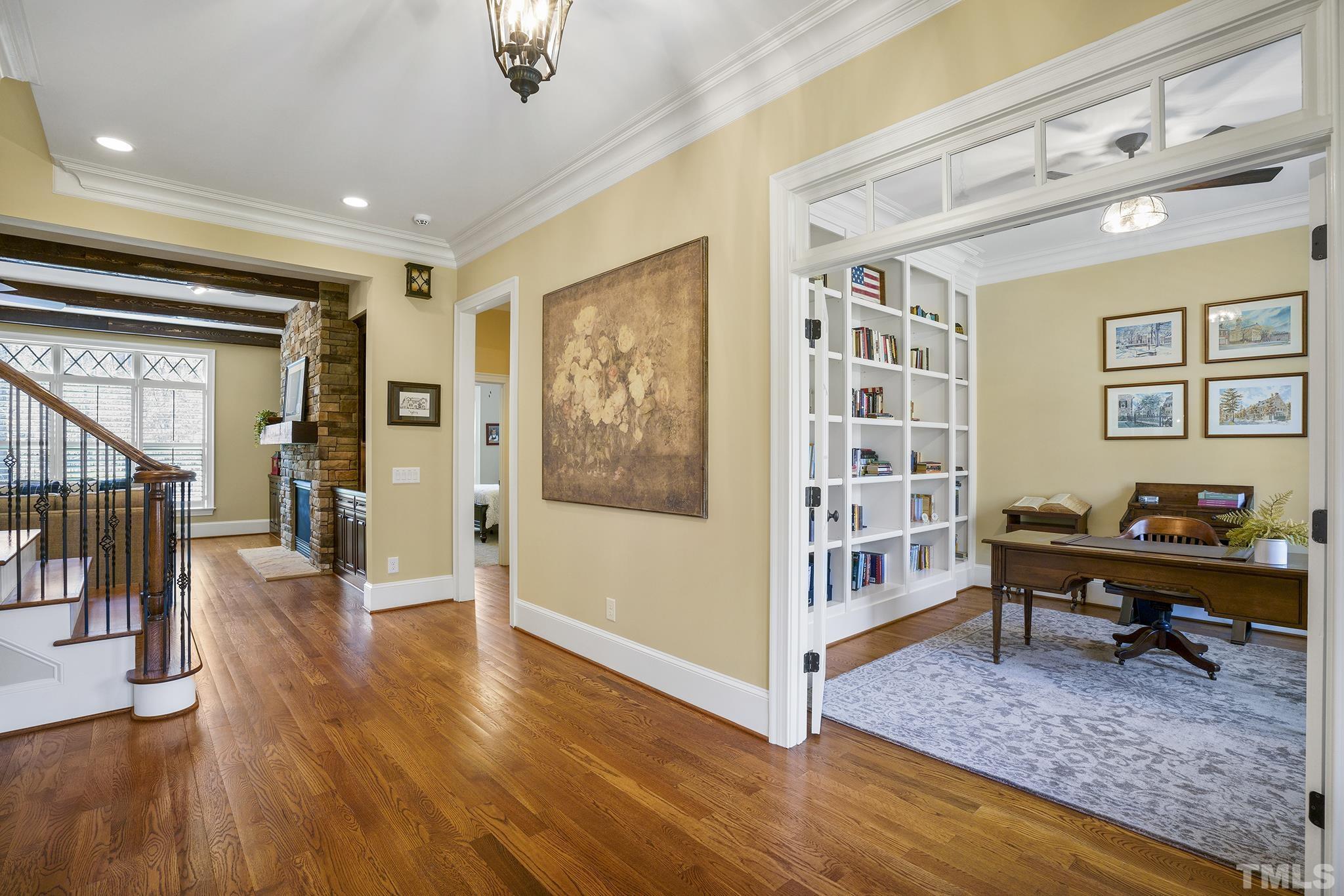 6837 Mactavish Way Raleigh, NC 27613 - Photo 9 of 48 a view of a livingroom with wooden floor and furniture
