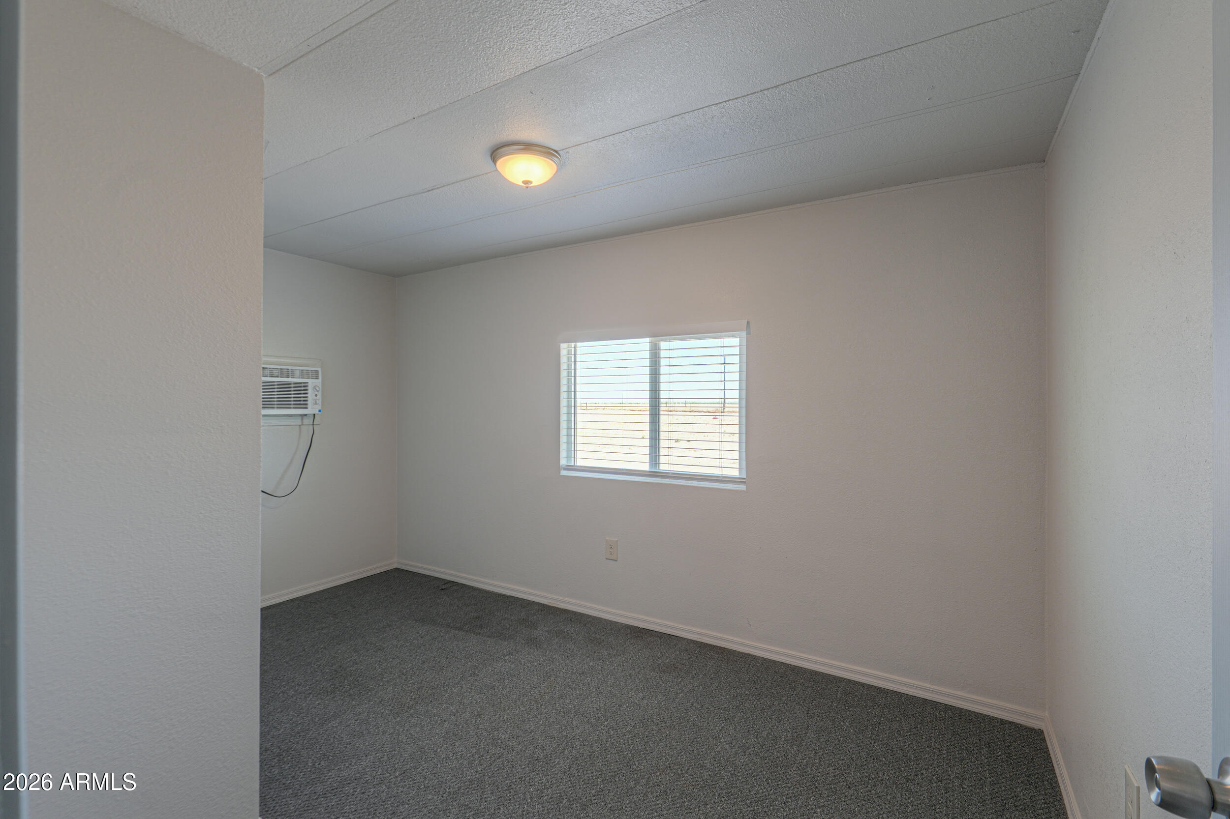 33776 West Siesta Road Stanfield, AZ 85172 - Photo 46 of 54 an empty room with a window