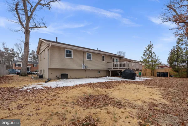 a view of a house with a snow in the yard