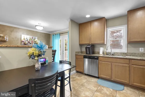 a kitchen with a sink cabinets and window