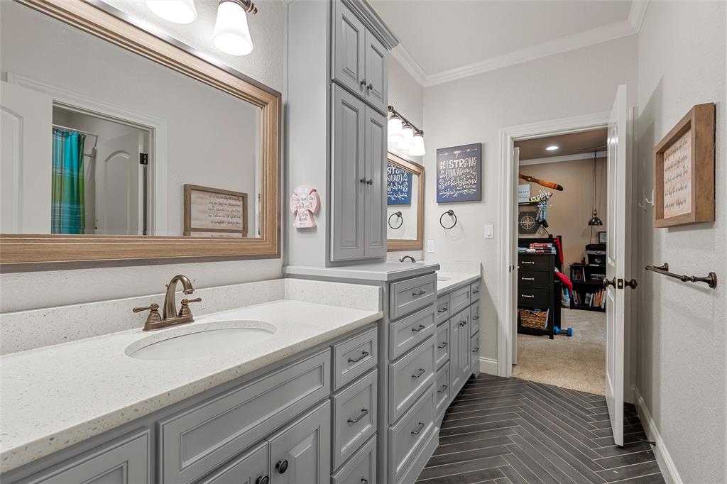 14690 Chapel Road Lorena, TX 76655 - Photo 19 of 40 a spacious bathroom with a double vanity sink and a mirror