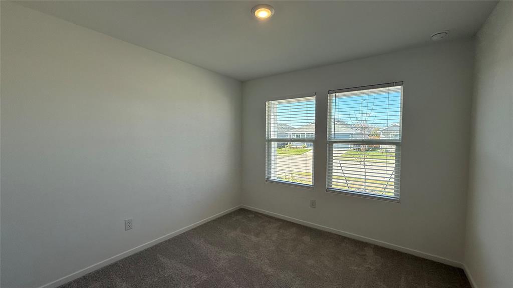 6725 Haines Drive Princeton, TX 75407 - Photo 18 of 25 an empty room with a window