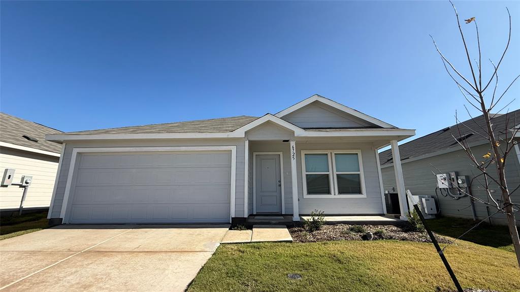 6725 Haines Drive Princeton, TX 75407 - Photo 2 of 25 a front view of a house with garden