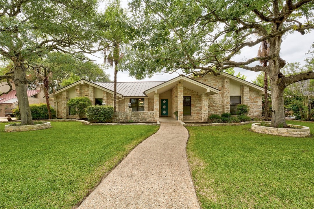 4504 Walton Heath Circle Austin, TX 78747 - Photo 1 of 1 a front view of a house with yard and green space
