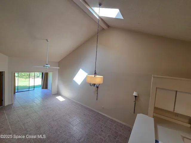 a view of a room that has a window in it