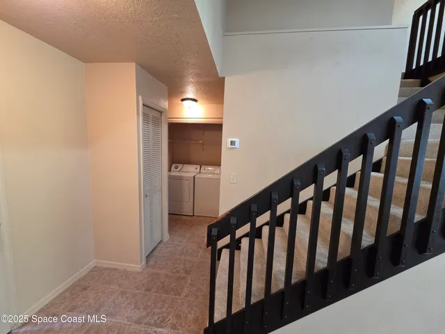 a view of hallway with stairs