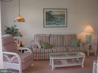 0 Edward Taylor Road, Unit 13 Ocean City, MD 21842 - Photo 3 of 5 a living room with furniture