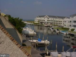 0 Edward Taylor Road, Unit 13 Ocean City, MD 21842 - Photo 5 of 5 a view of a lake with outdoor seating
