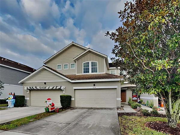 a front view of a house with a garage