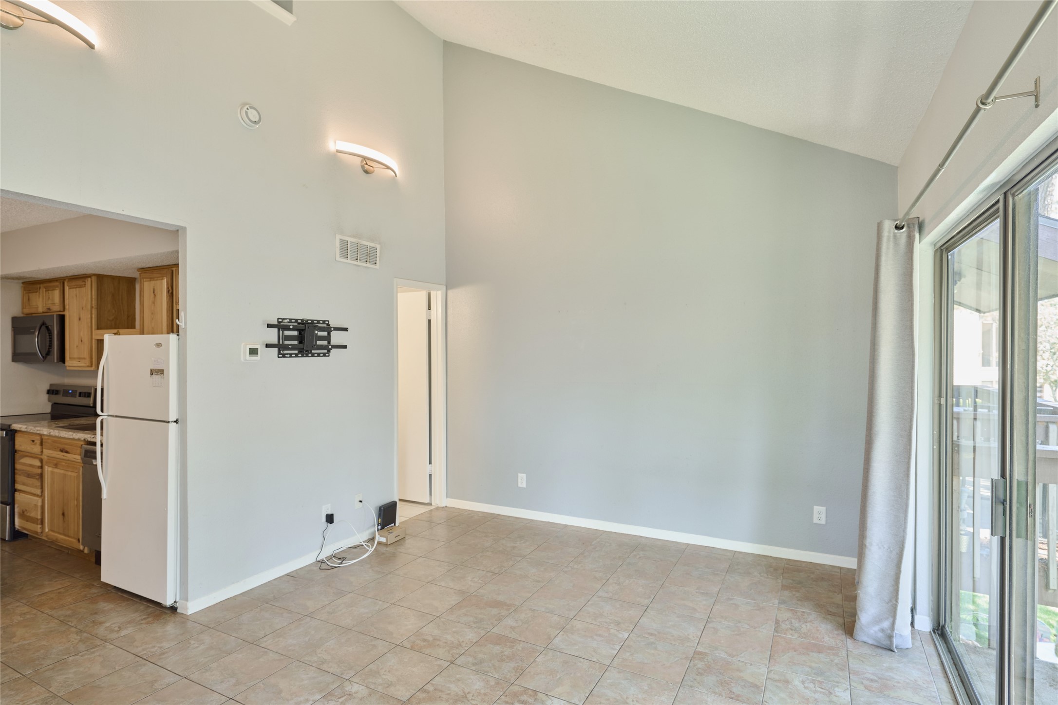 12900 Walden Road, Unit 622F Montgomery, TX 77356 - Photo 11 of 32 a view of a hallway with a dining room