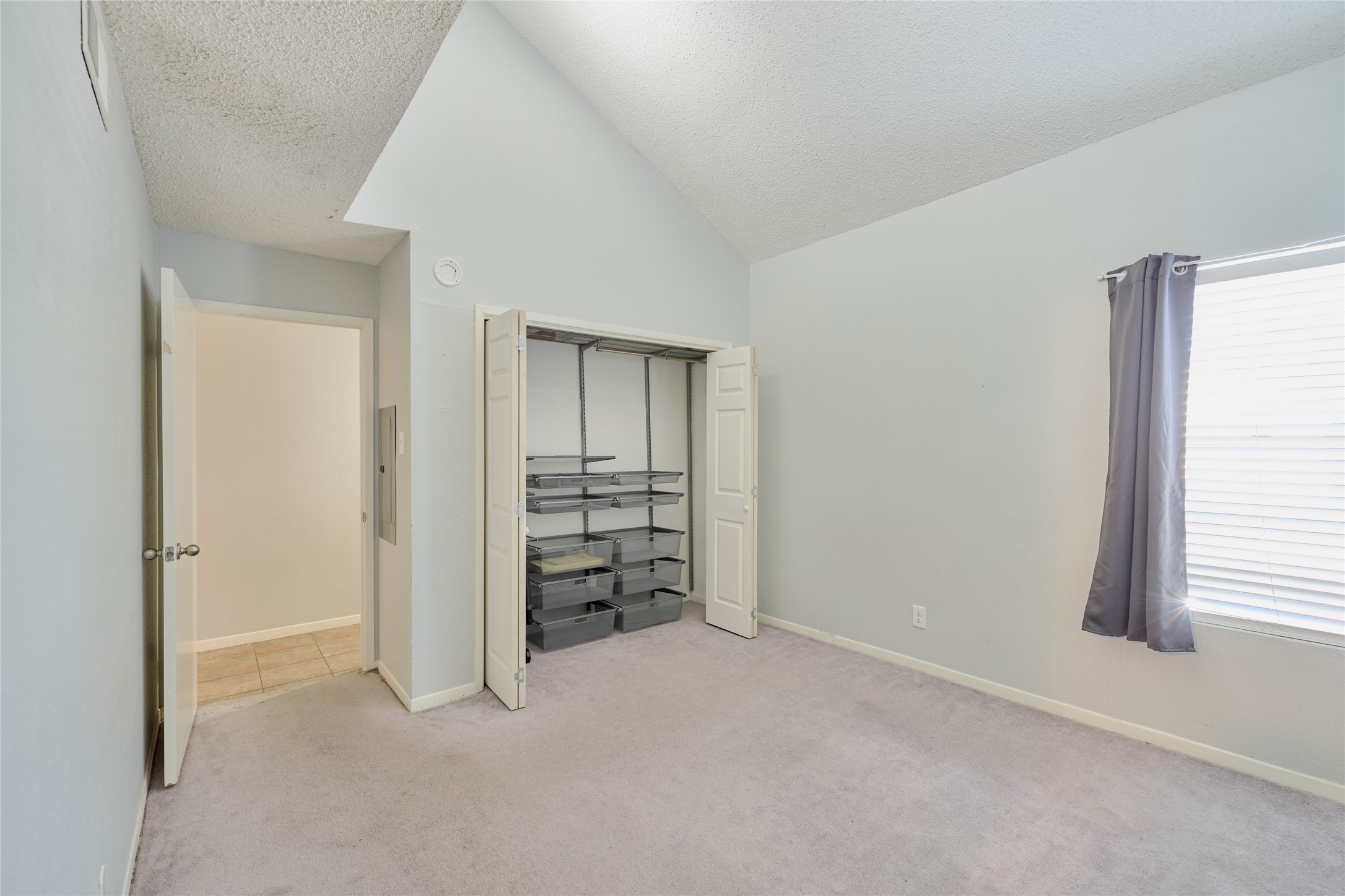 12900 Walden Road, Unit 622F Montgomery, TX 77356 - Photo 14 of 32 an empty room with windows and closet