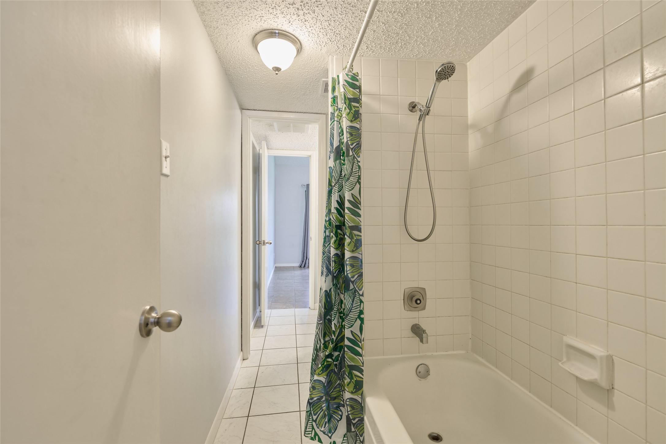 12900 Walden Road, Unit 622F Montgomery, TX 77356 - Photo 16 of 32 a bathroom with a glass shower door