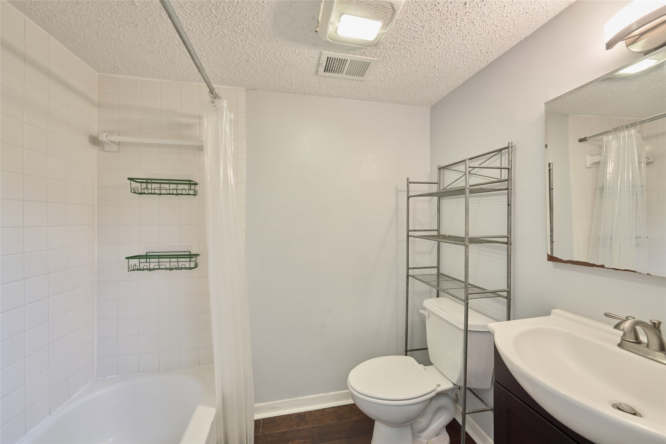 12900 Walden Road, Unit 622F Montgomery, TX 77356 - Photo 23 of 32 a bathroom with a sink toilet and shower