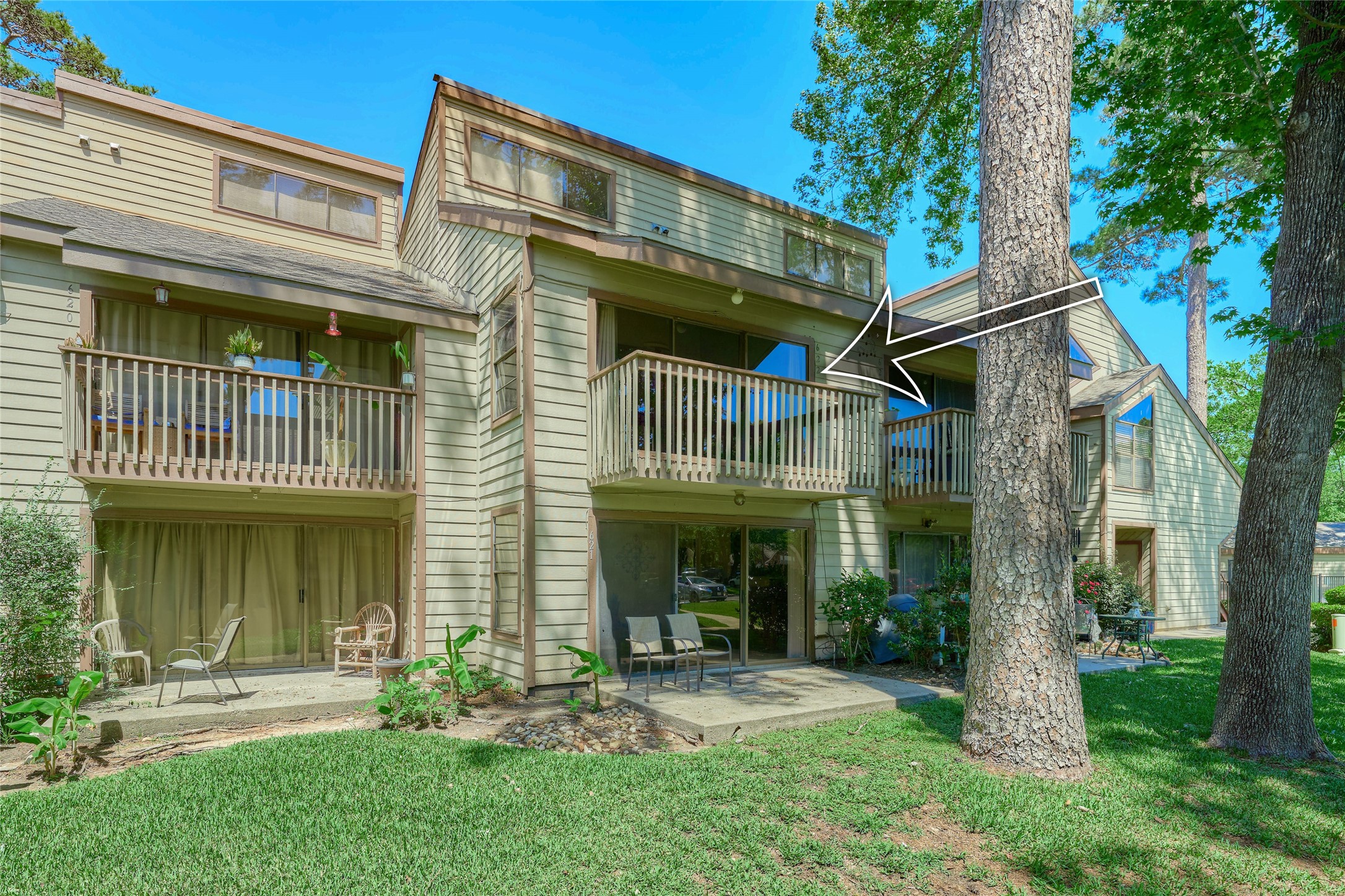 12900 Walden Road, Unit 622F Montgomery, TX 77356 - Photo 27 of 32 a front view of a house with garden