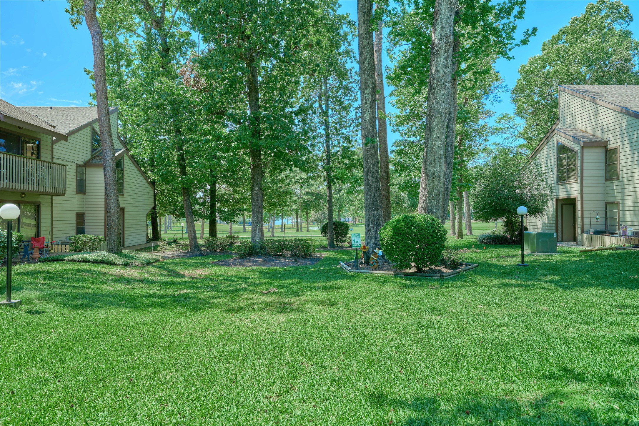 12900 Walden Road, Unit 622F Montgomery, TX 77356 - Photo 28 of 32 a view of a park that has large trees and plants