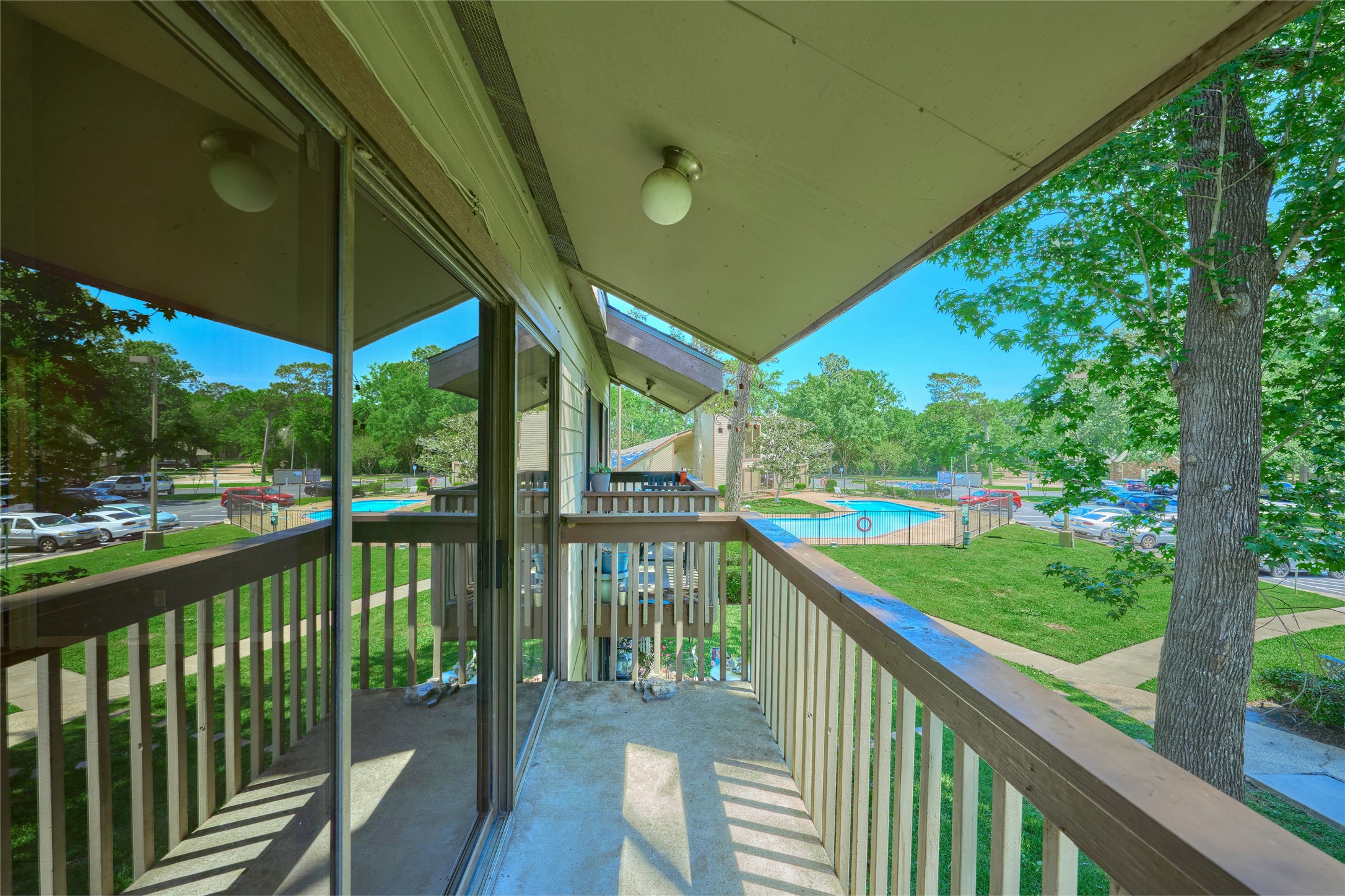 12900 Walden Road, Unit 622F Montgomery, TX 77356 - Photo 30 of 32 a view of a wooden deck next to a yard