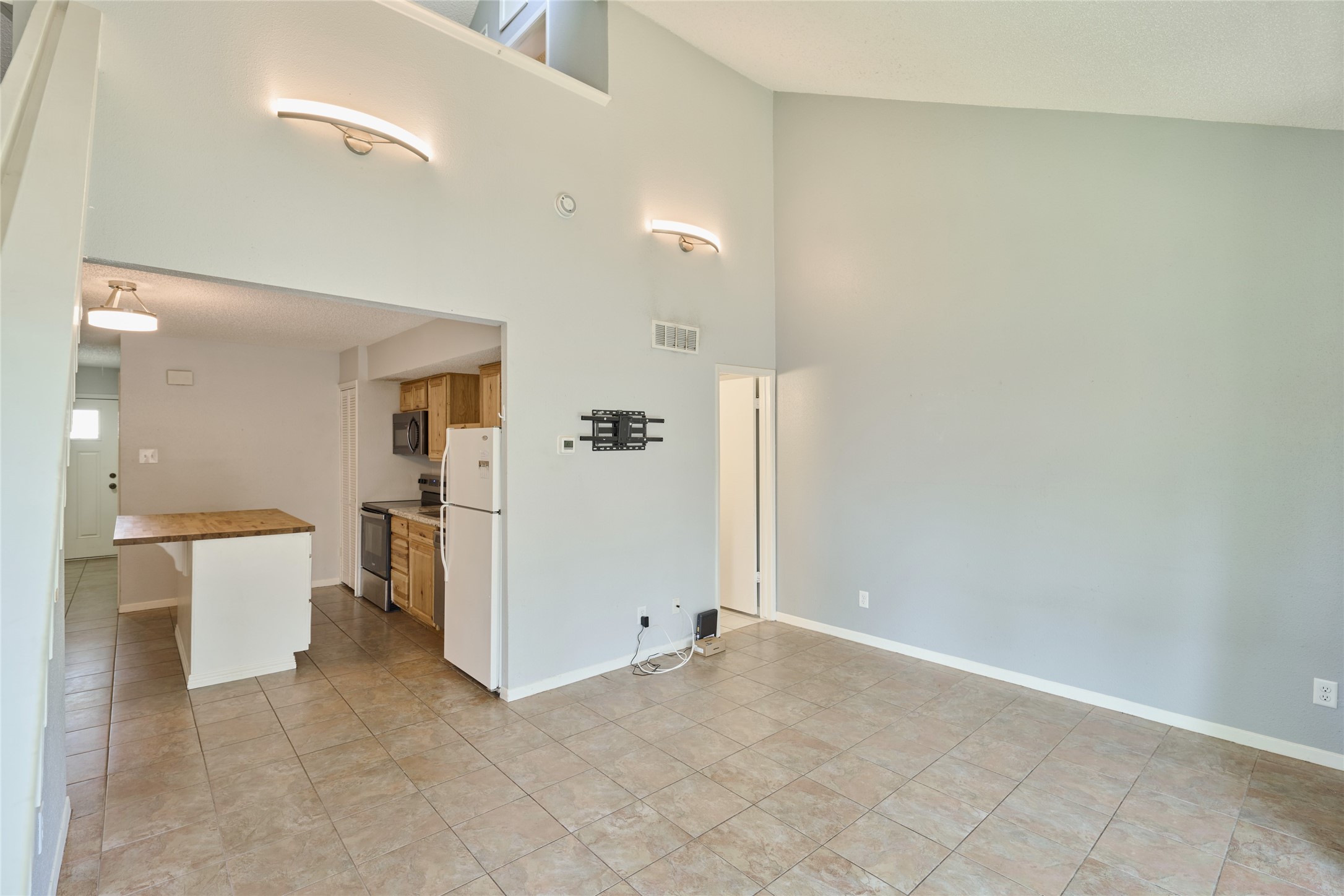 12900 Walden Road, Unit 622F Montgomery, TX 77356 - Photo 10 of 32 a view of a kitchen with a refrigerator and a sink