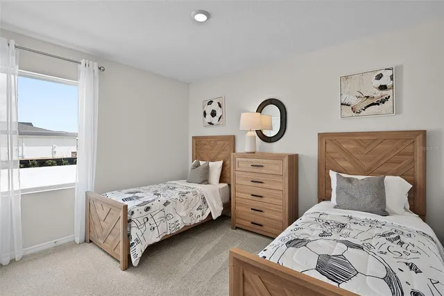 a bedroom with a bed and cabinet