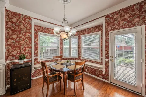 a view of a dining room with furniture window and outside view