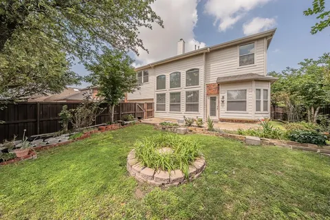 a house view with a garden space