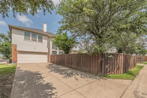 a backyard of a house with trees