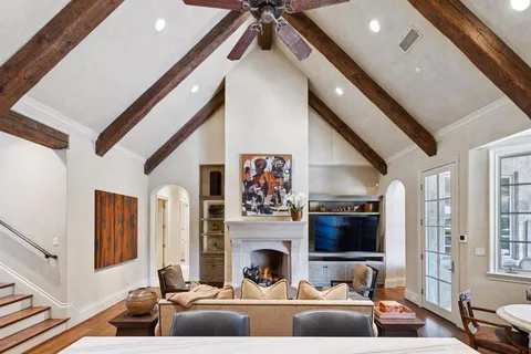 a living room with furniture fireplace and flat screen tv