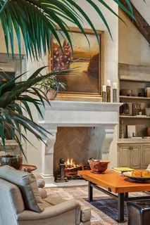 a reading room with furniture and a floor to ceiling window