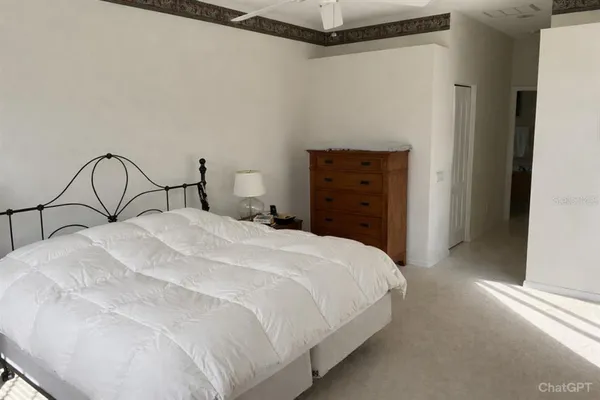 a bedroom with a bed and a dresser