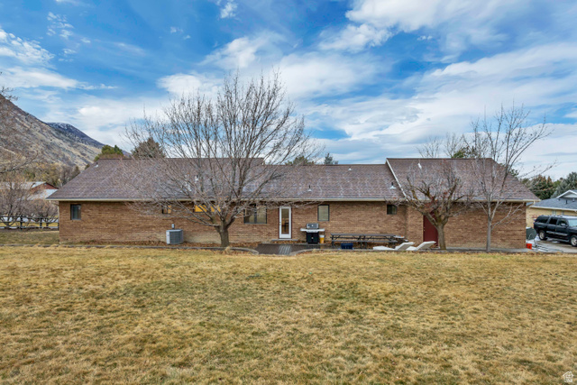 887 Village Way Alpine, UT 84004 - Photo 6 of 28 Rear view of property with a patio area, brick siding, and a yard
