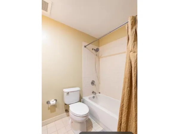 a bathroom with a toilet a sink and a bathtub